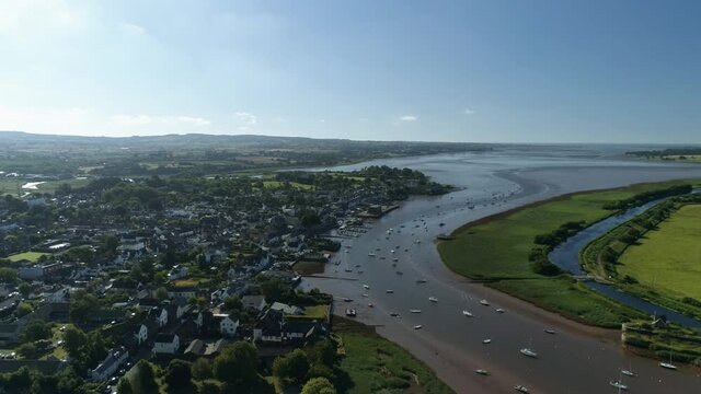 Topsham, Devon, aerial vista shot across the river Exe and the town on a sunny day