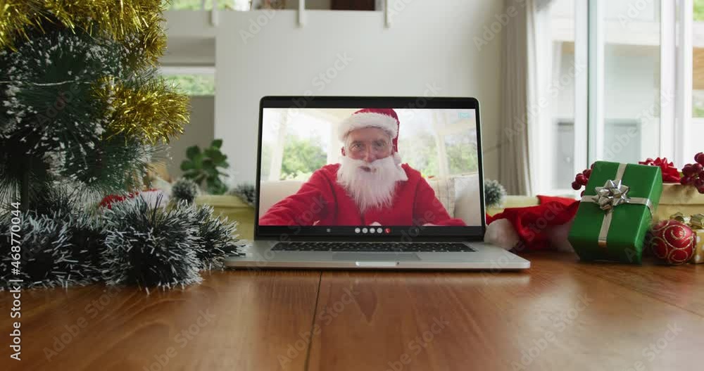 Sticker Caucasian man with santa costume on christmas video call on laptop