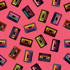 Original vector seamless pattern in vintage style. Background of multicolored audio cassettes.