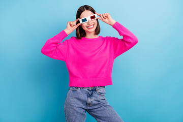 Photo of funky charming young lady wear pink pullover smiling arms vr glasses isolated blue color background