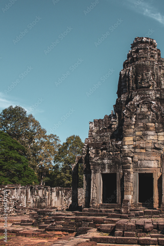 Canvas Prints vertical shot of an ancient buddhist temple of bayon with a carved serene smiling face