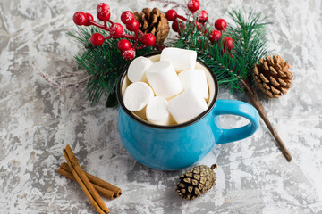 Obraz na płótnie Canvas Delicious marshmallows in a blue cup on a light background festive background. Winter and Christmas mood