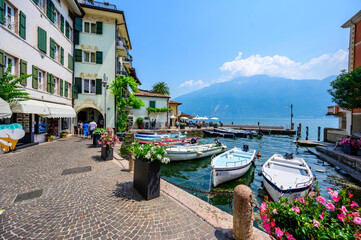 Limone sul Garda - harbour village at Lake Garda with beautiful mountain scenery, Italy - travel destination - obrazy, fototapety, plakaty
