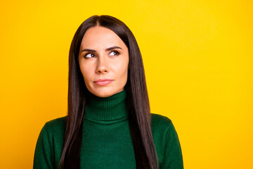 Photo of young serious thoughtful minded businesswoman look copyspace thinking isolated on yellow...