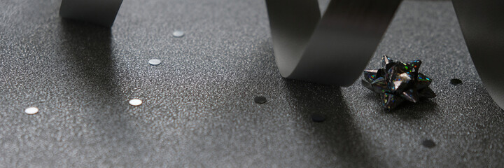 Happy New Year and Merry Christmas. Silver accessories on a shiny silver background