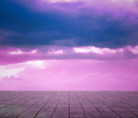 pink clouds, blue sky, gray floor.