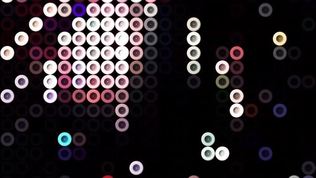 Old school pixels animation flickering on black background. Motion. Colorful running circle snakes, design of retro game for children.