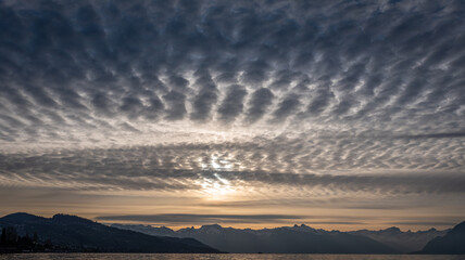 Fototapeta premium Sunrise over the mountains. Dramatic sky. Lausanne, Switzerland.