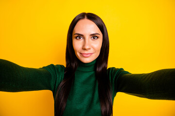 Photo of nice optimistic brunette long hairdo lady do selfie wear green sweater isolated on bright yellow color background