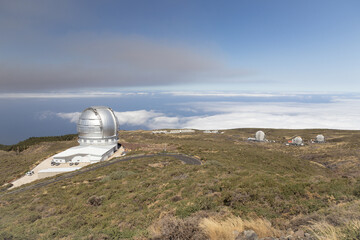 The ash plume (smoke, fume) from volcanic eruption above Gran Telescopio Canarias, Roque de los...