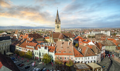 Fototapeta na wymiar Sibiu, Romania from the Council Tower with the Small Square (Piata Mica) and the ramp heading to the Lower town, while the Evanghelical Lutheran Cathedral dominates the skyline.
