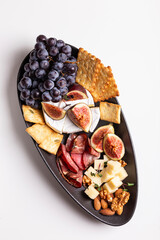 Assorted cheese, prosciutto, nuts, snacks and fruits