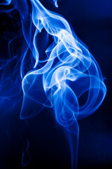 Motion blue smoke on black background.