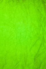 Green paper crumpled texture background.