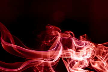 Red smoke motion on black background.