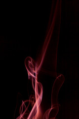 Obraz premium Red smoke motion on black background.