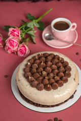 Coffee mousse cake with dark chocolate , sweet dessert over pink background