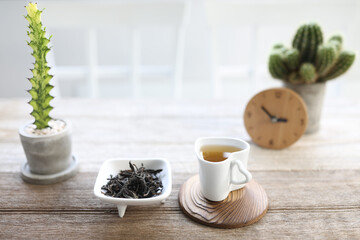 Small heart tea cup tea pile on wooden table