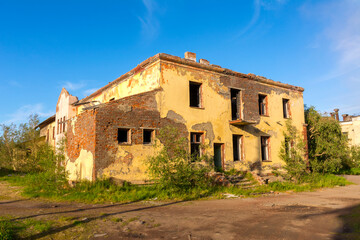 A two-storey abandoned house on a deserted street in an abandoned settlement Severny, Russia
