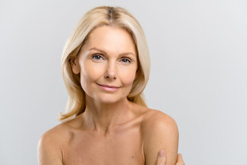 Headshot of elegant beautiful middle-aged woman, gorgeous and bright mature lady with pure skin...