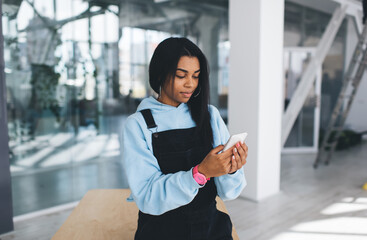 Black girl watching something on mobile phone