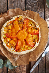 Pie with cheese, tomatoes and fish. Top view.