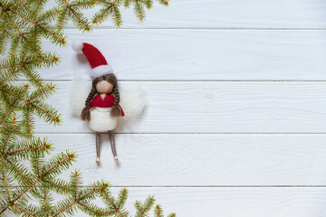 Santa angel on the white background with fir tree