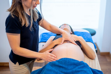 Pregnant woman in clinic undergoing special treatment