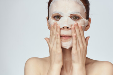 pretty woman naked shoulders face mask close-up skin care
