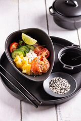 Dinner with fresh poke salad with salmon