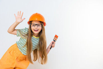 A little girl in glasses and a construction mask looks out from the corner. renovation in the apartment. The child is going to paint the walls.