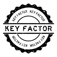 Grunge black key factor word round rubber seal stamp on white background