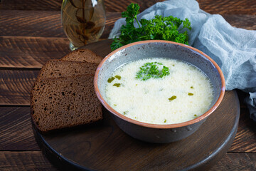 Delicious creamy beef soup. Vegetable creamy soup with beef, herbs and bread