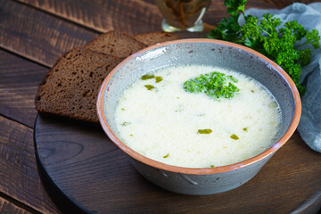 Delicious creamy beef soup. Vegetable creamy soup with beef, herbs and bread