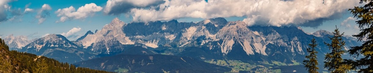 High resolution stitched panorama of a beautiful alpine summer view with the famous Dachstein mountains in the background at the Reiteralm, Pichl, Schladming, Steiermark, Austria