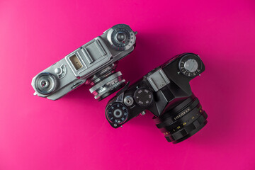 Old film camera on a colored background
