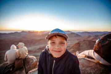 little boy traveler on Mount Sinai in Egypt.