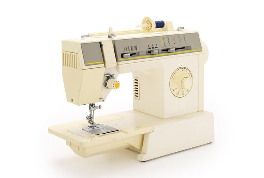 Sewing machine isolated on completely white background. Contains clipping path