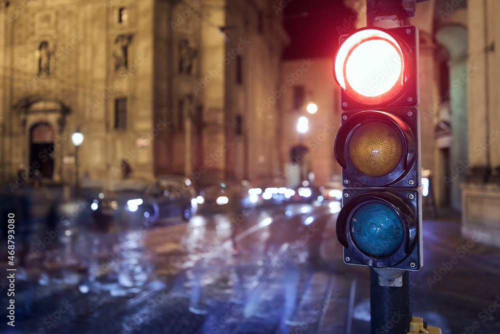 Poster Red light on traffic lights against crosswalk. Night scene of city street in Prague, Czech Republic.