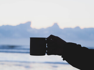 hand holding a glass