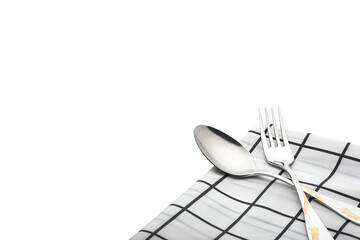 metal fork and spoon lay on table cloth isolated on white background