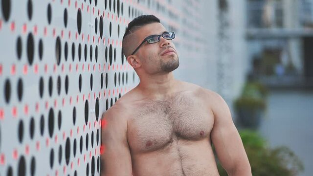 Muscular young man Arab posing against white background.