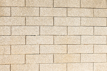 Background of sand colored brick wall texture horizontal photo