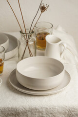 Scandinavian nordic style. Set of different modern white empty   ceramic tableware and glasses....