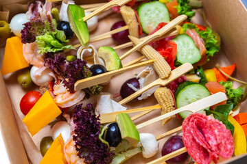 Gourmet snacks on sticks delivered for party. Snack food delivery