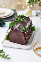 Buche de Noel. Traditional Christmas dessert, Christmas yule log cake with chocolate cream....