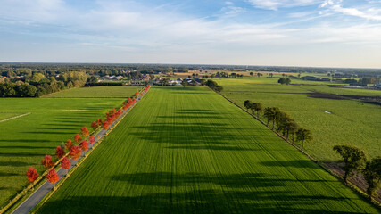 Land or landscape of green field in aerial view. Include agriculture farm, house building, village. That real estate or property. Plot of land for housing subdivision, development, sale or investment