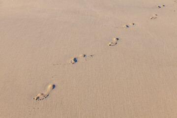 human footsteps at the beach