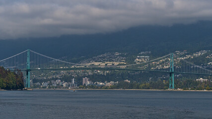 View of Lions Gate Bridge (First Narrows Bridge) crossing Burrard Inlet in Vancouver, British Columbia, Canada with the city of West Vancouver.