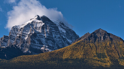 Stunning view of rugged Mount Temple in Banff National Park, Alberta, Canada with snow-capped peak...
